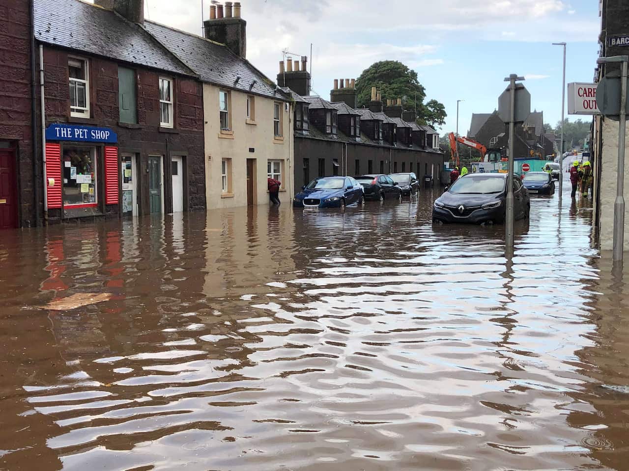Flooding in Stonehaven, Aberdeenshire in Scotland, where a nearby train has derailed.