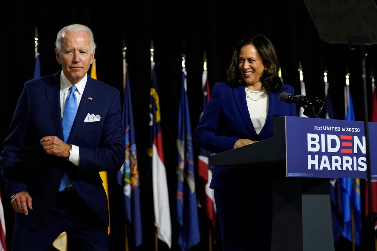 Democratic presidential candidate Joe Biden and his running mate Kamala Harris speak together at Alexis Dupont High School.