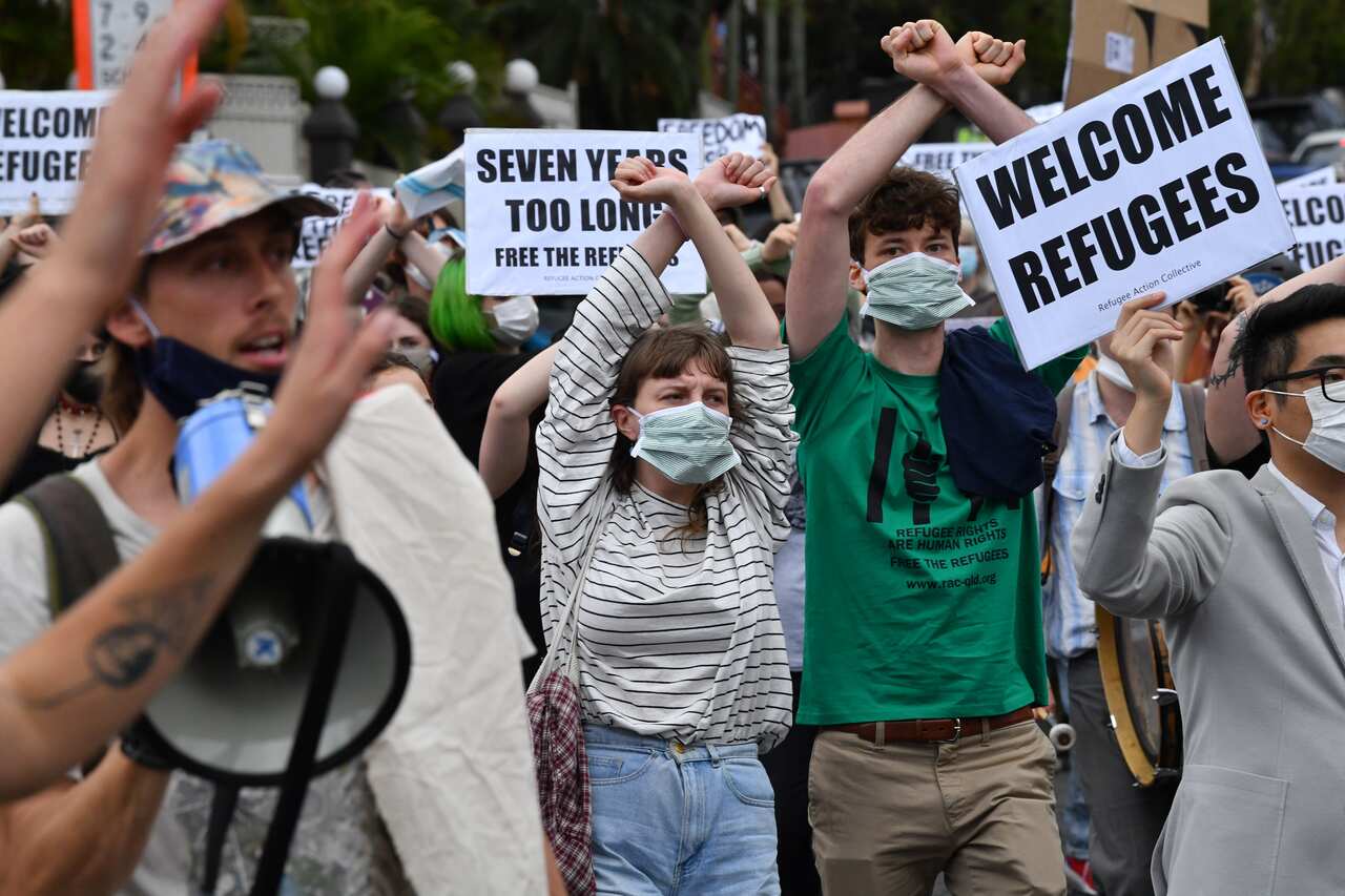 Protesters are seen during a rally in support of asylum seekers detained at the Kangaroo Point Central Hotel in Brisbane, Saturday, August 15, 2020. 