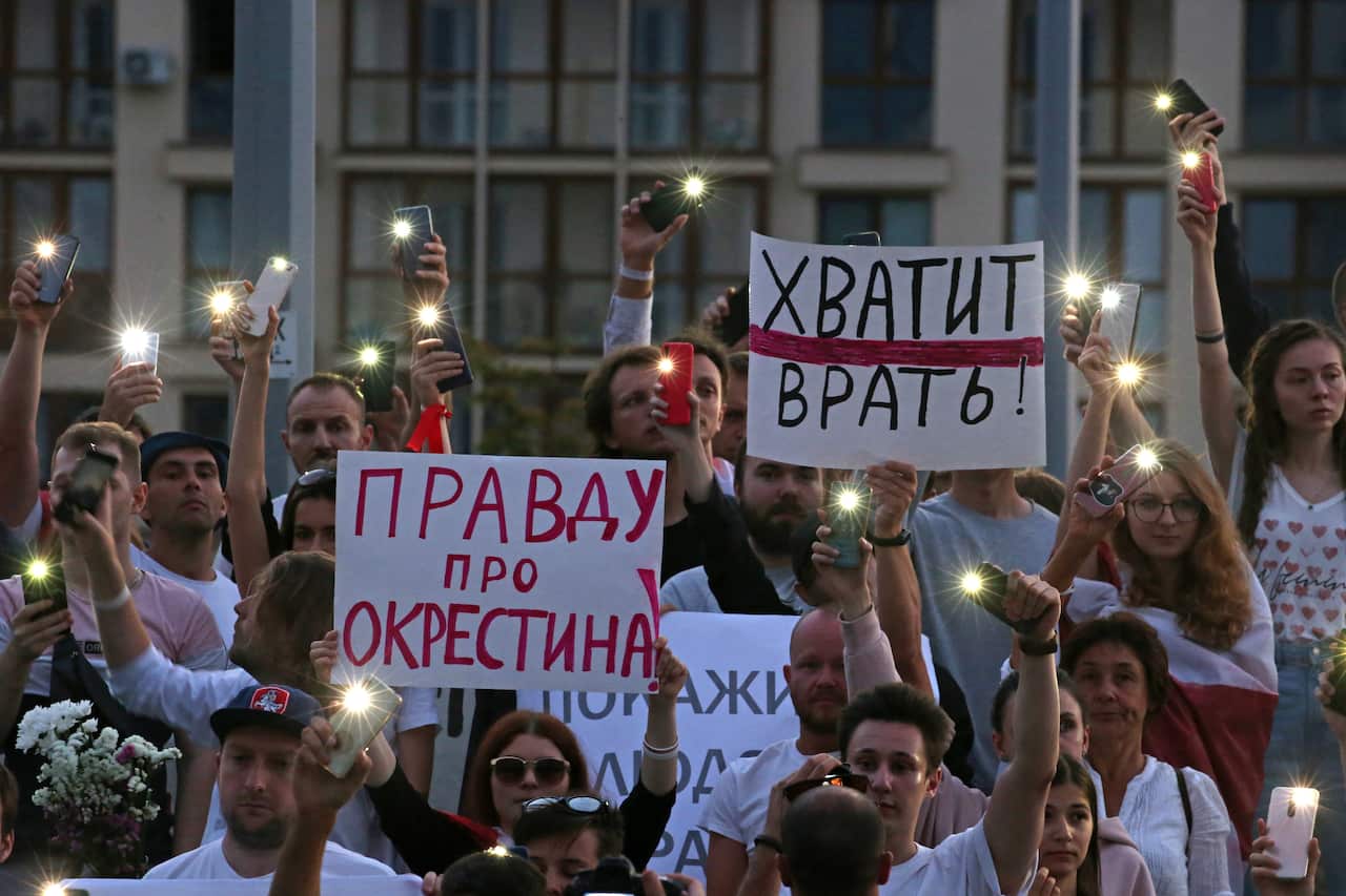Protesters gather outside the building of the Belarusian National Television and Radio Company.