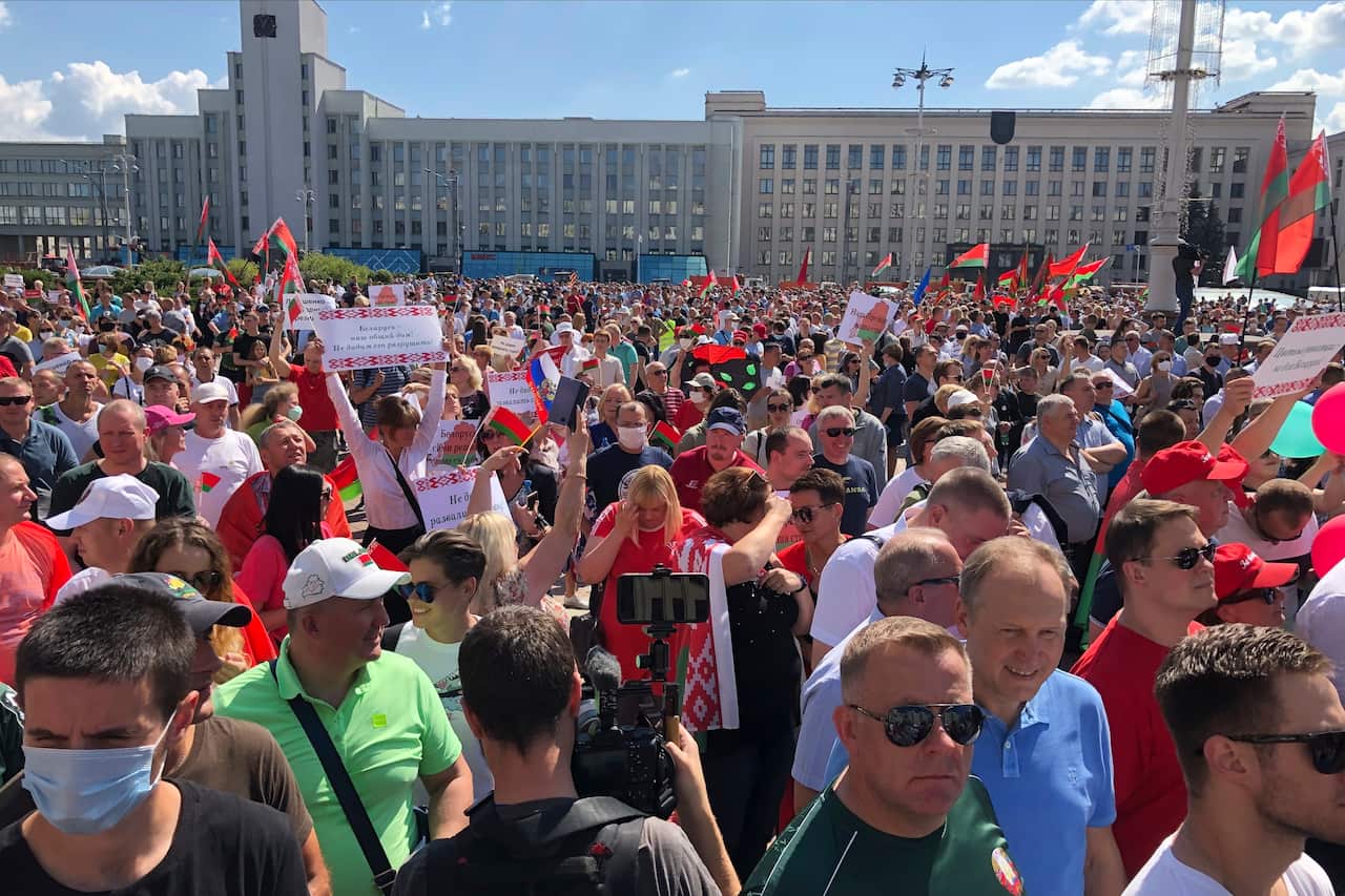 Hundreds of supporters of Belarusian President Alexander Lukashenko with Belarusian State flags gather at Independent Square of Minsk, Belarus.
