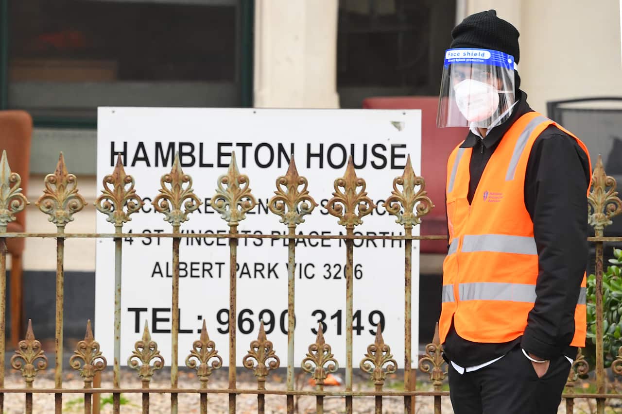 A security guard is seen outside of Hambleton House in Melbourne, Monday, August 17, 2020.                                                                                                                       