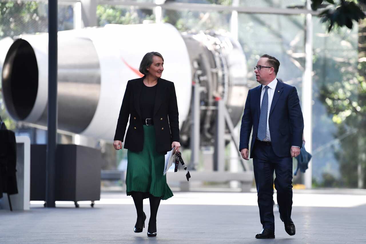 Qantas Group Chief Executive Officer Alan Joyce and CFO Vanessa Hudson walk through QANTAS headquarters following their results announcement on Thursday.