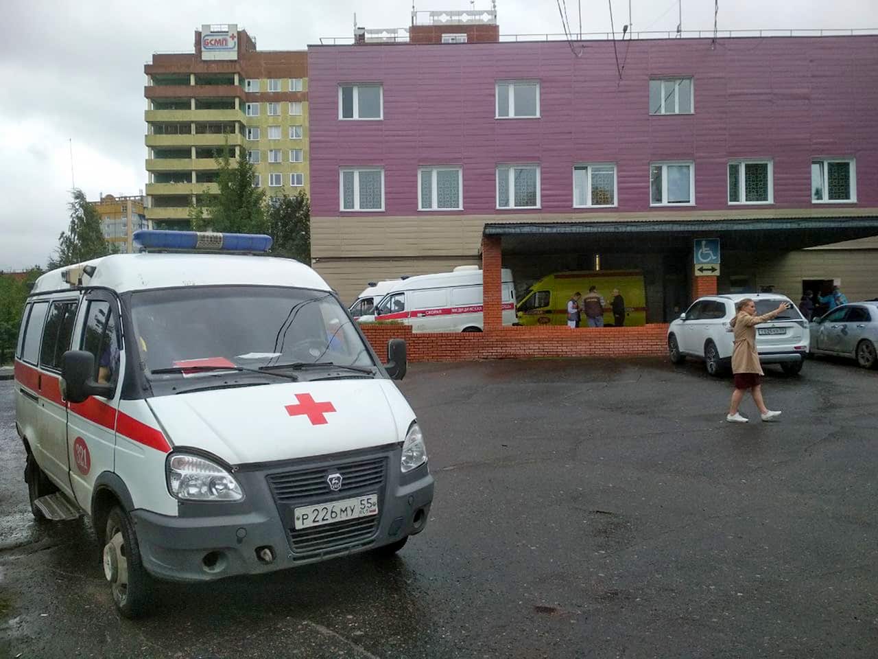 An ambulance parked next to a building of a hospital intensive care unit where Alexei Navalny is hospitalized in Omsk, Russia.