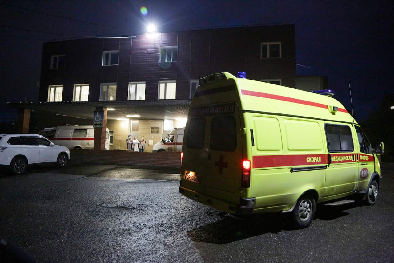 An ambulance is parked outside the hospital intensive care unit where Alexei Navalny is hospitalized in Omsk, Russia.
