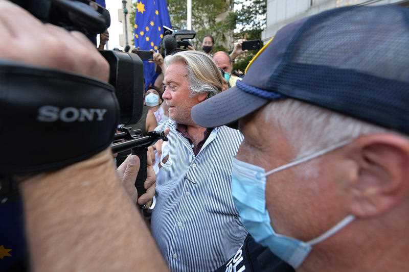 Former adviser to President Donald J. Trump, Steve Bannon (centre), walks out of a Manhattan Federal Court in New York.