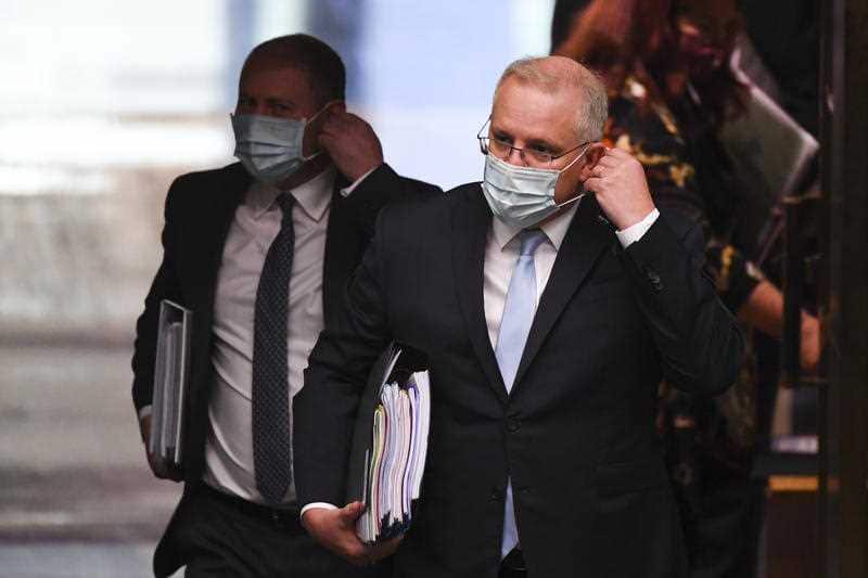 Prime Minister Scott Morrison and Treasurer Josh Frydenberg arrive during House of Representatives Question Time. 