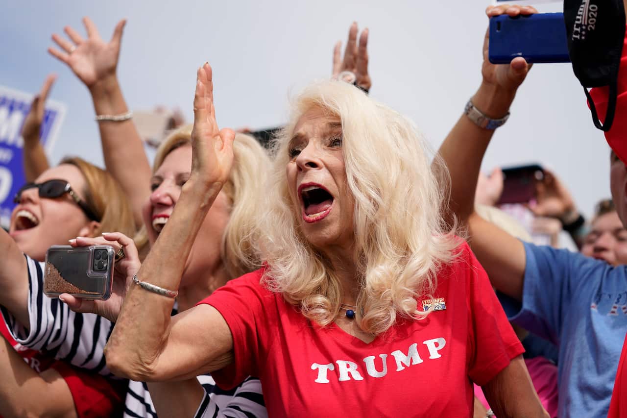 People people cheer as they wait to hear President Donald Trump speak at Asheville Regional Airport, Monday, Aug. 24, 2020, in Fletcher, N.C. (AP Photo/Evan Vucci)
