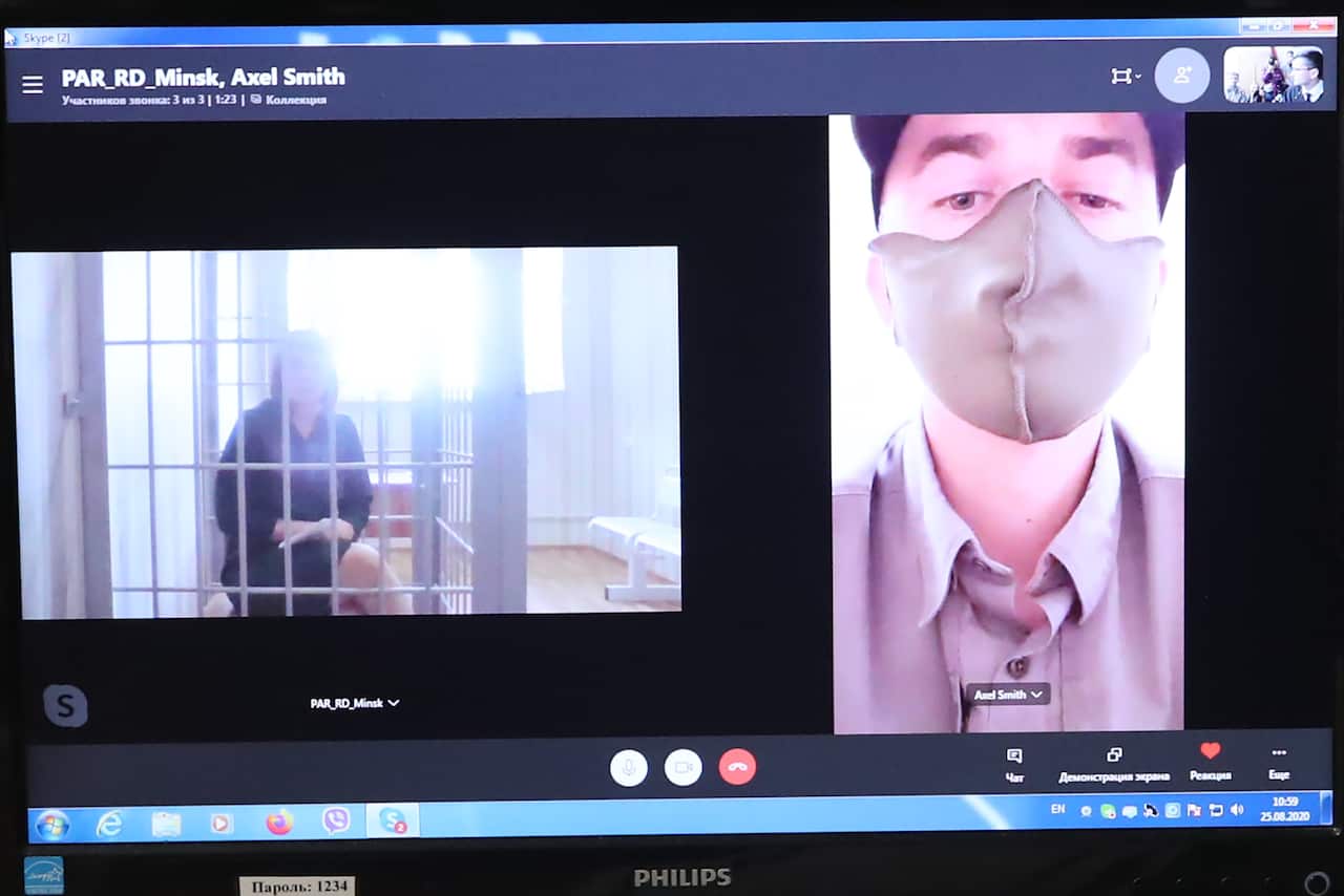 Olga Kovalkova (left on the screen), accused of organising unauthorised mass events, during an online hearing of Minsk's  District Court. 