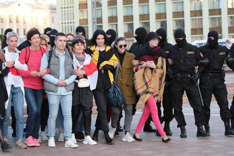 Belarus women are pushed by Police during a peaceful protest rally against the results of the presidential elections, in Minsk.