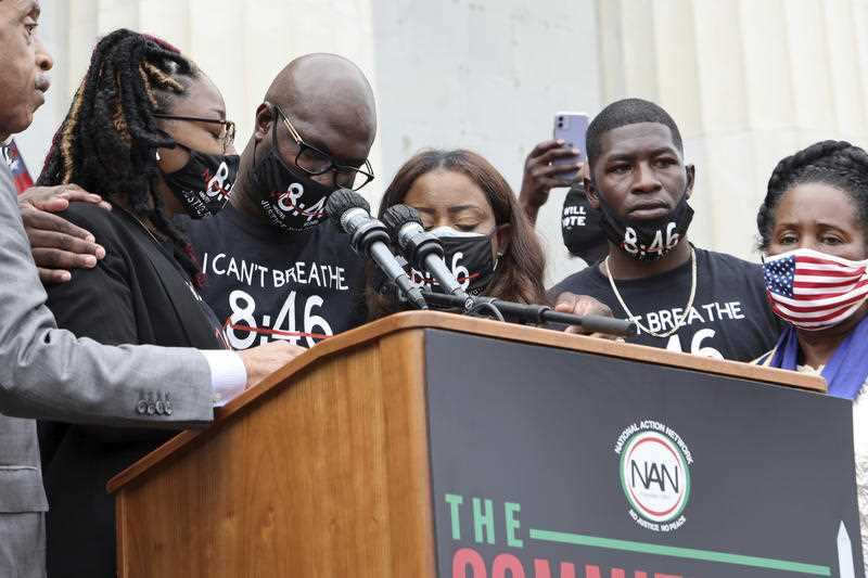 Bridgett Floyd, the sister of George Floyd, is flanked by Rev. Al Sharpton, her brother Philonise and Rep. Sheila Jackson Lee, D-Texa.