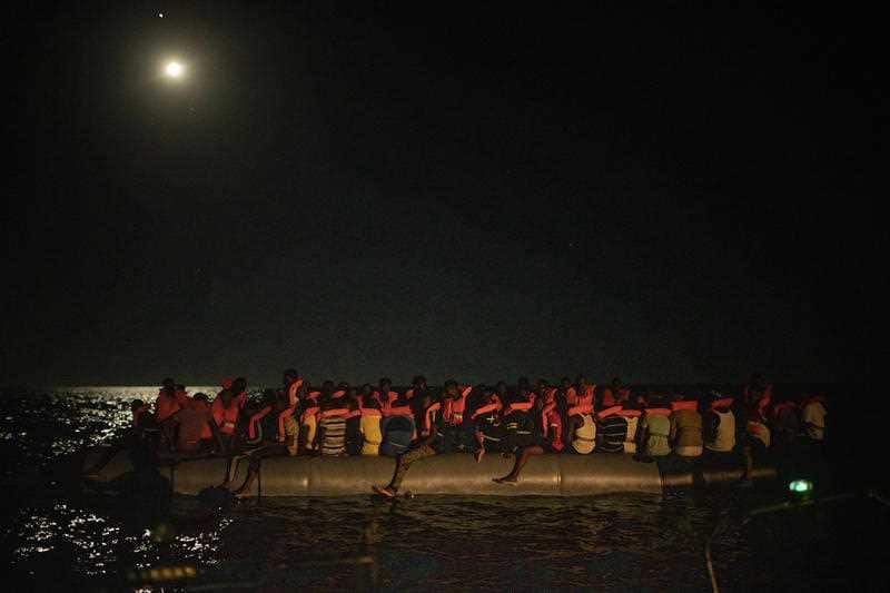 Men from different African nationalities wait to be assisted by crew members of the Louise Michel and Astral rescue vessels. 