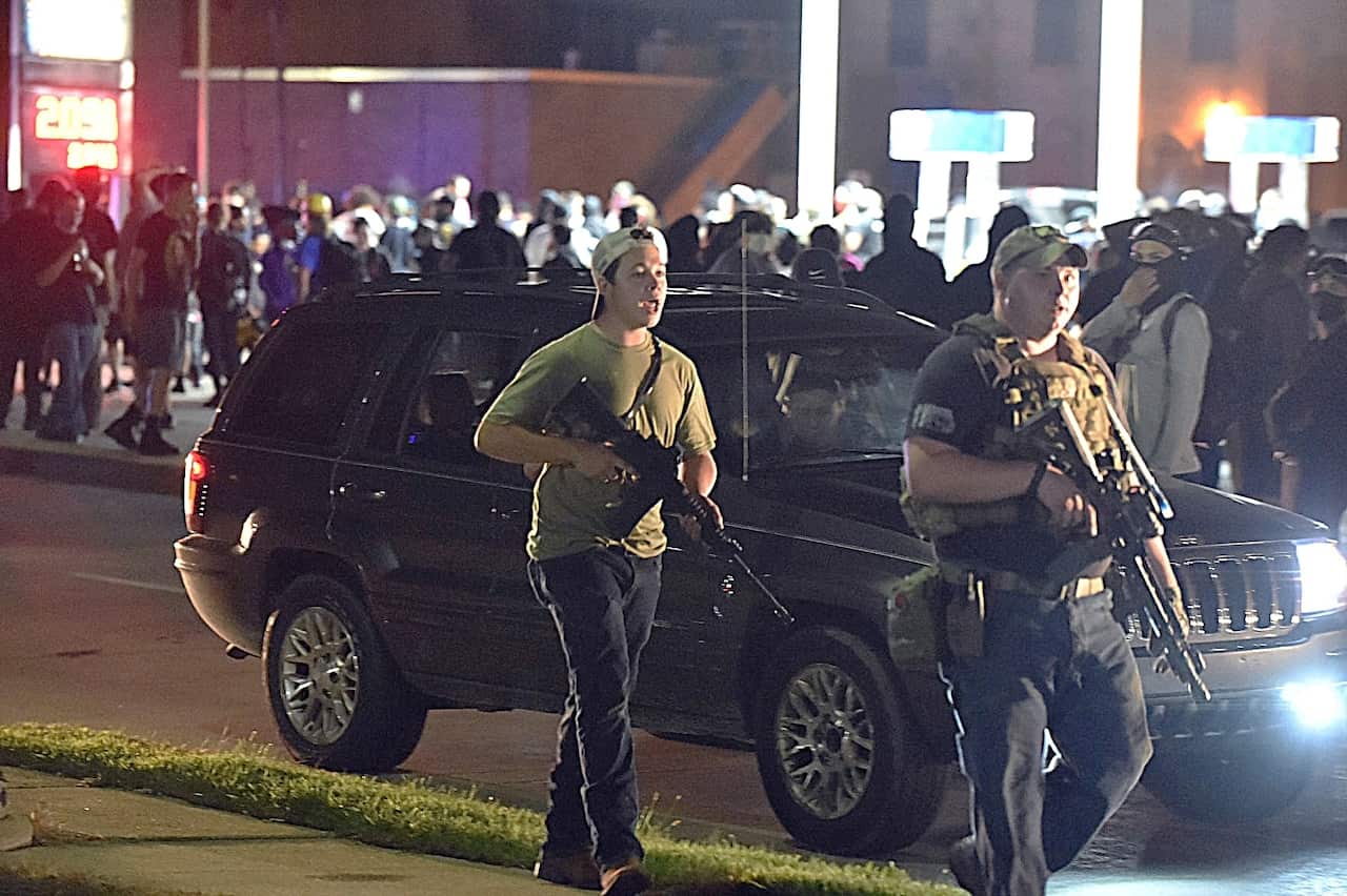 Kyle Rittenhouse is seen carrying a weapon during a night of unrest in Kenosha, Wisconsin, following the police shooting of Jacob Blake, 25 August, 2020.