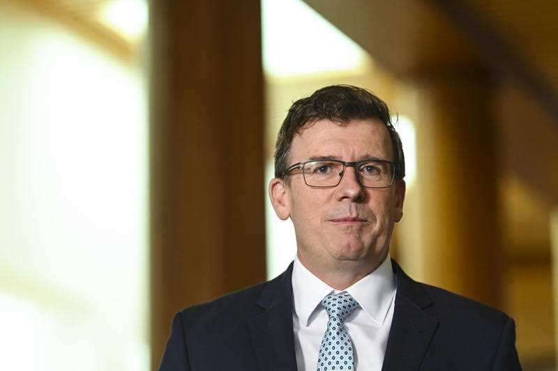 Acting immigration minister Alan Tudge speaks to the media at Parliament House in Canberra.