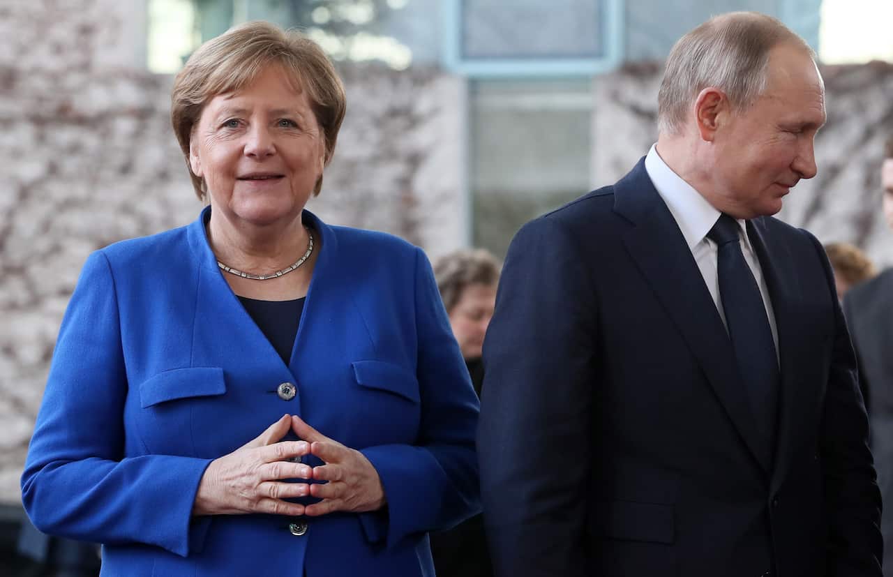 German Chancellor Angela Merkel (L) and Russian President Vladimir Putin (R) during the International Libya Conference in Berlin, Germany, 19 January 2020.