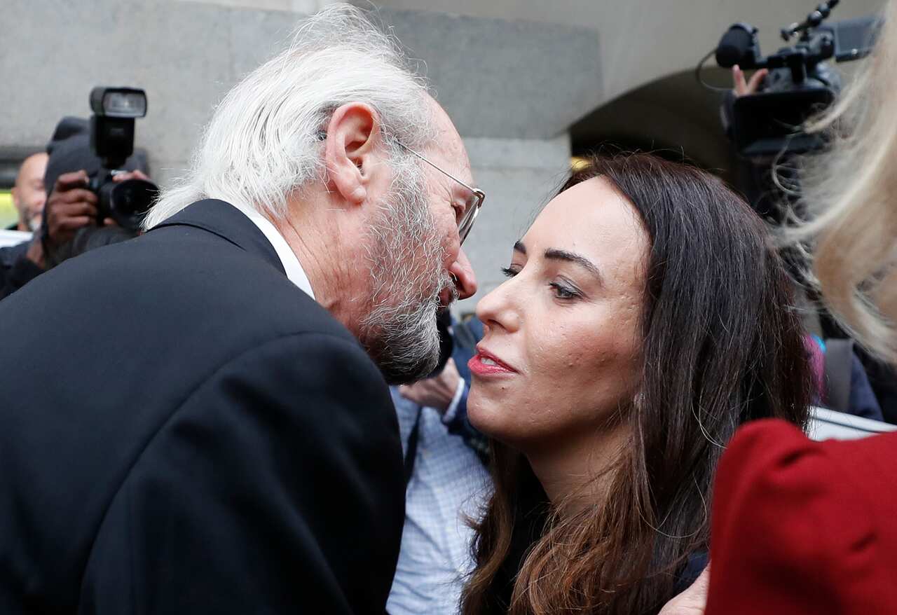 Julian Assange's father John Shipton and girlfriend Stella Morris greet each other in front of the Central Criminal Court Old Bailey, in London on 7 September.