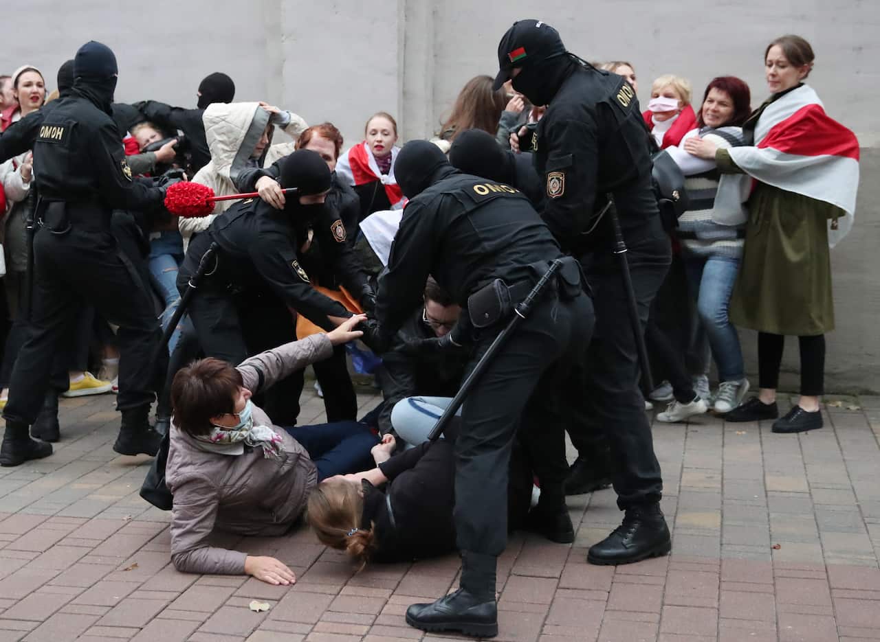 Police in Belarus detain opposition activitists during a march in support of Maria Kolesnikova.
