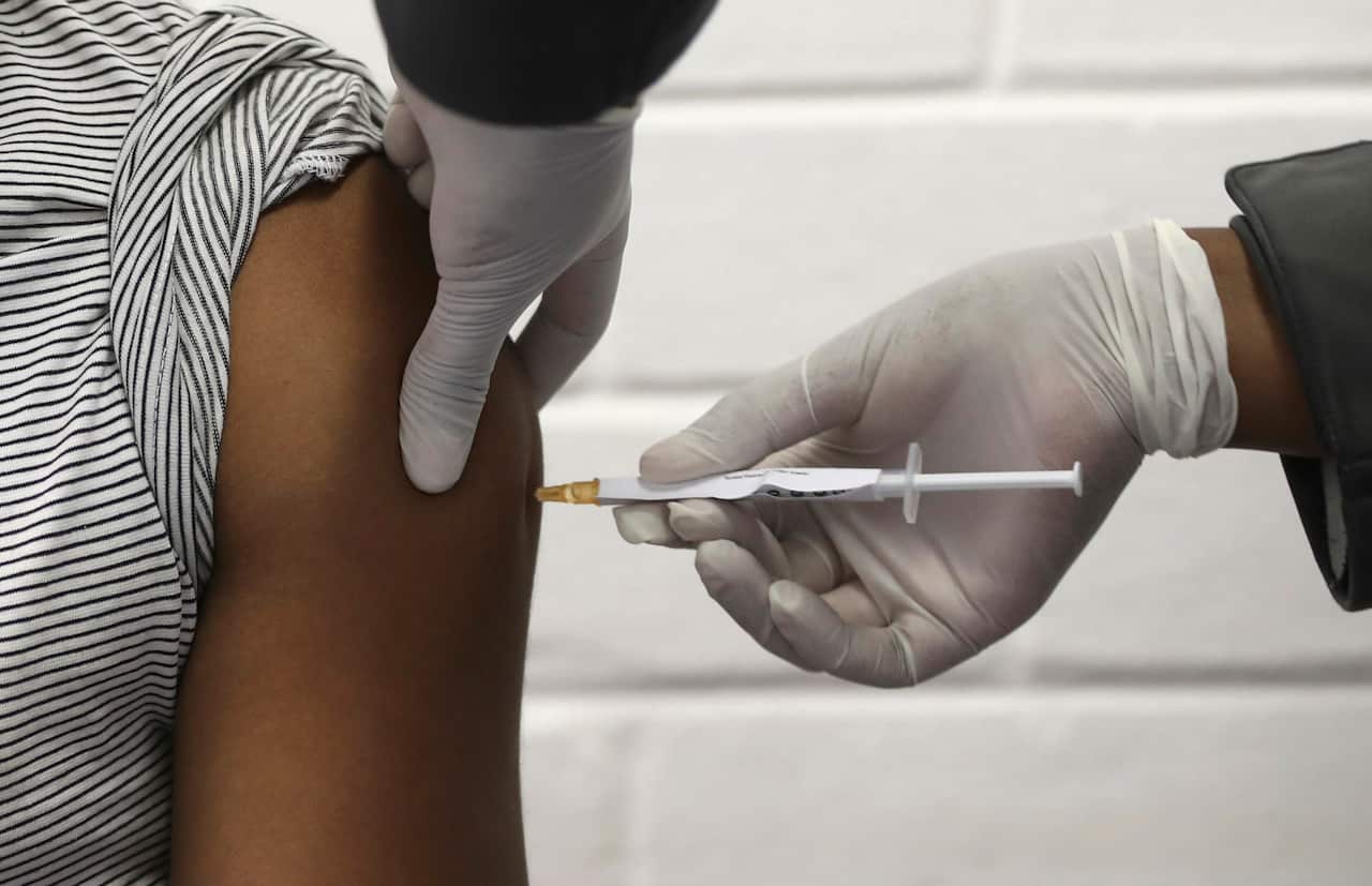 A vaccine volunteer in Johannesburg receives an injection developed at the University of Oxford in Britain.