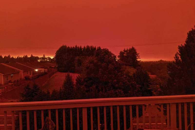 This photo taken from the home of Russ Casler in Salem, Oregon shows the smoke-darkened sky well before sunset at around 5 pm, Tuesday, Sept. 8, 2020