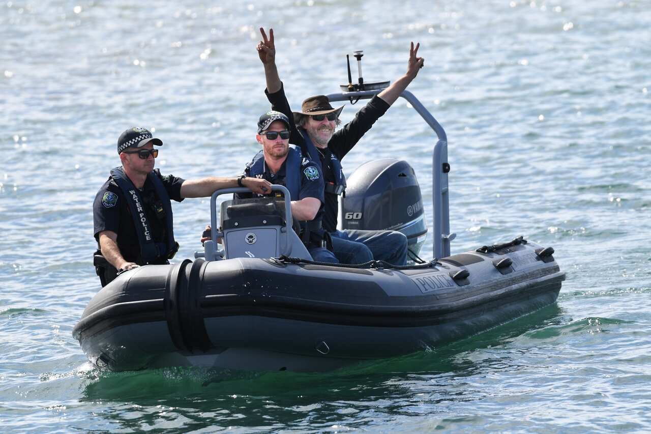 Fisherman Derek Robinson reacts after seeing his family on his to return at Encounter Bay, South Australia.