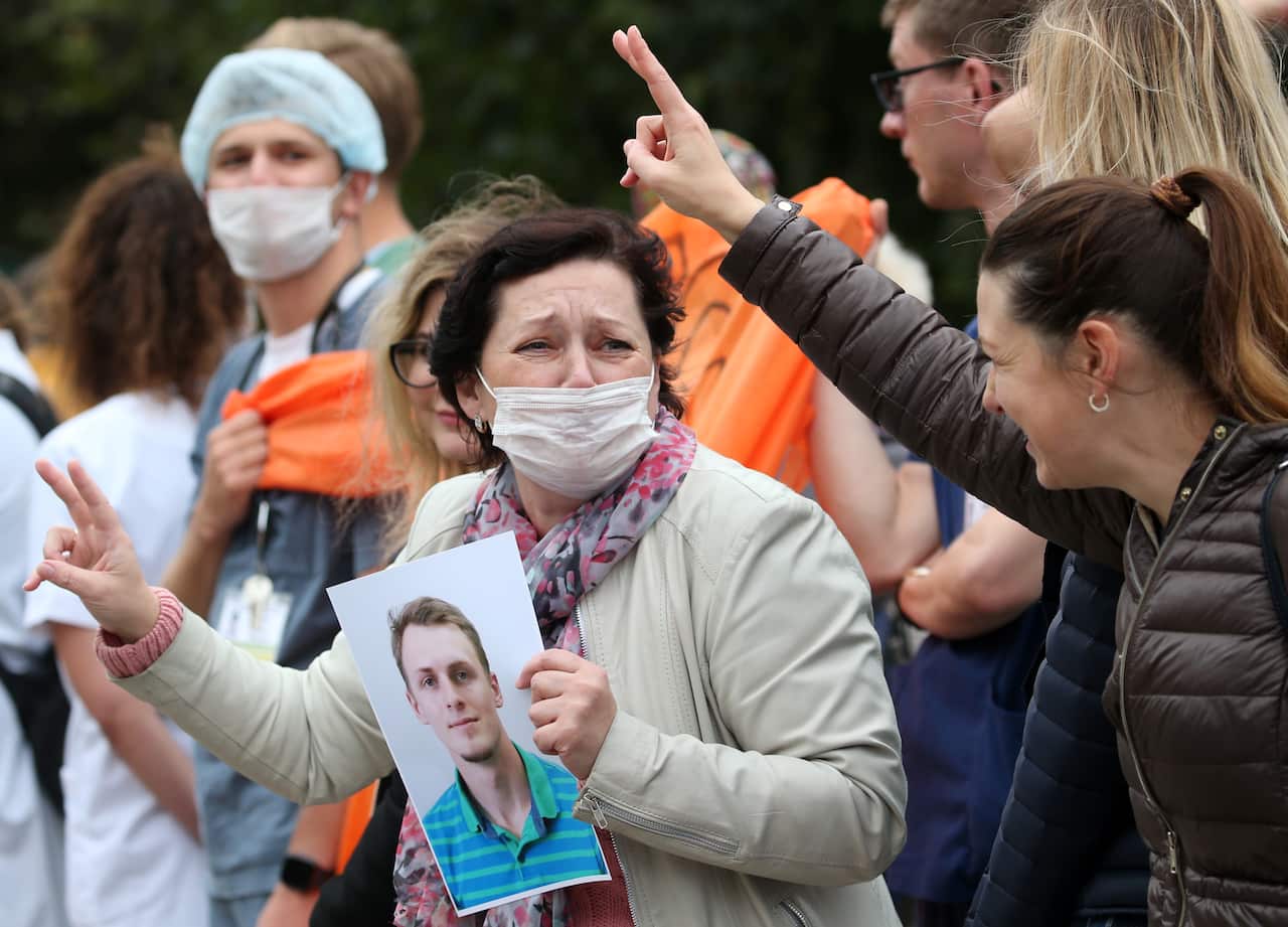 People take part in a rally in support of detained healthcare workers in Belarus.