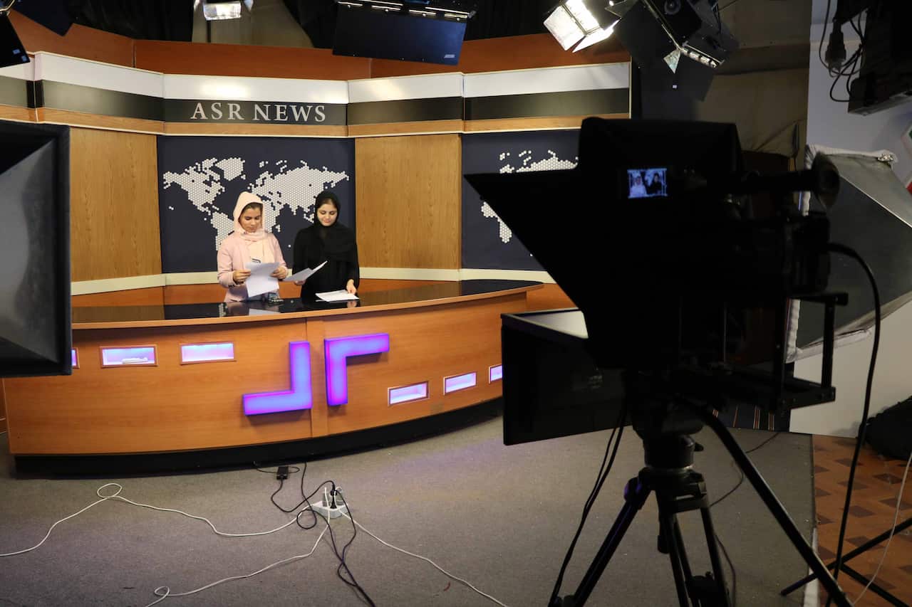  Afghan women journalists work at Asr News TV station in Herat, Afghanistan, 16 September 2020.