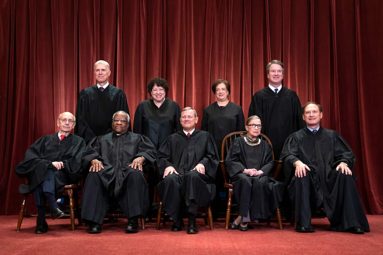 The US Supreme Court bench as seen in 2018. If Amy Coney Barrett replaced Justice Ruth Bader Ginsberg (F-2-R) the court would have a 6-3 conservative bias.