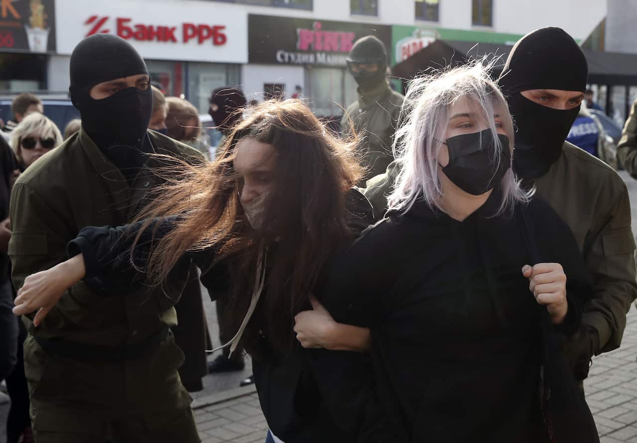 Riot police in Belarus on Saturday bundled hundreds of women into vans.