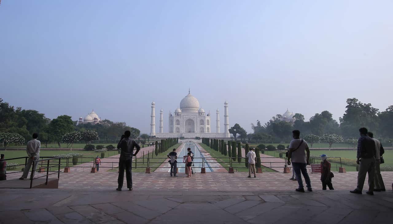 Indian tourists visit the Taj Mahal in Agra, India.