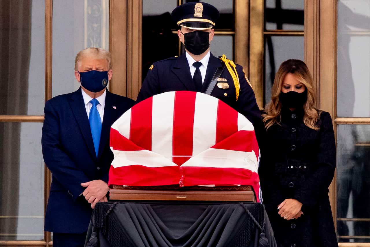 US President Donald Trump and First Lady Melania Trump view the flag-draped casket of late US Supreme Court Justice Ruth Bader Ginsburg in Washington, DC.