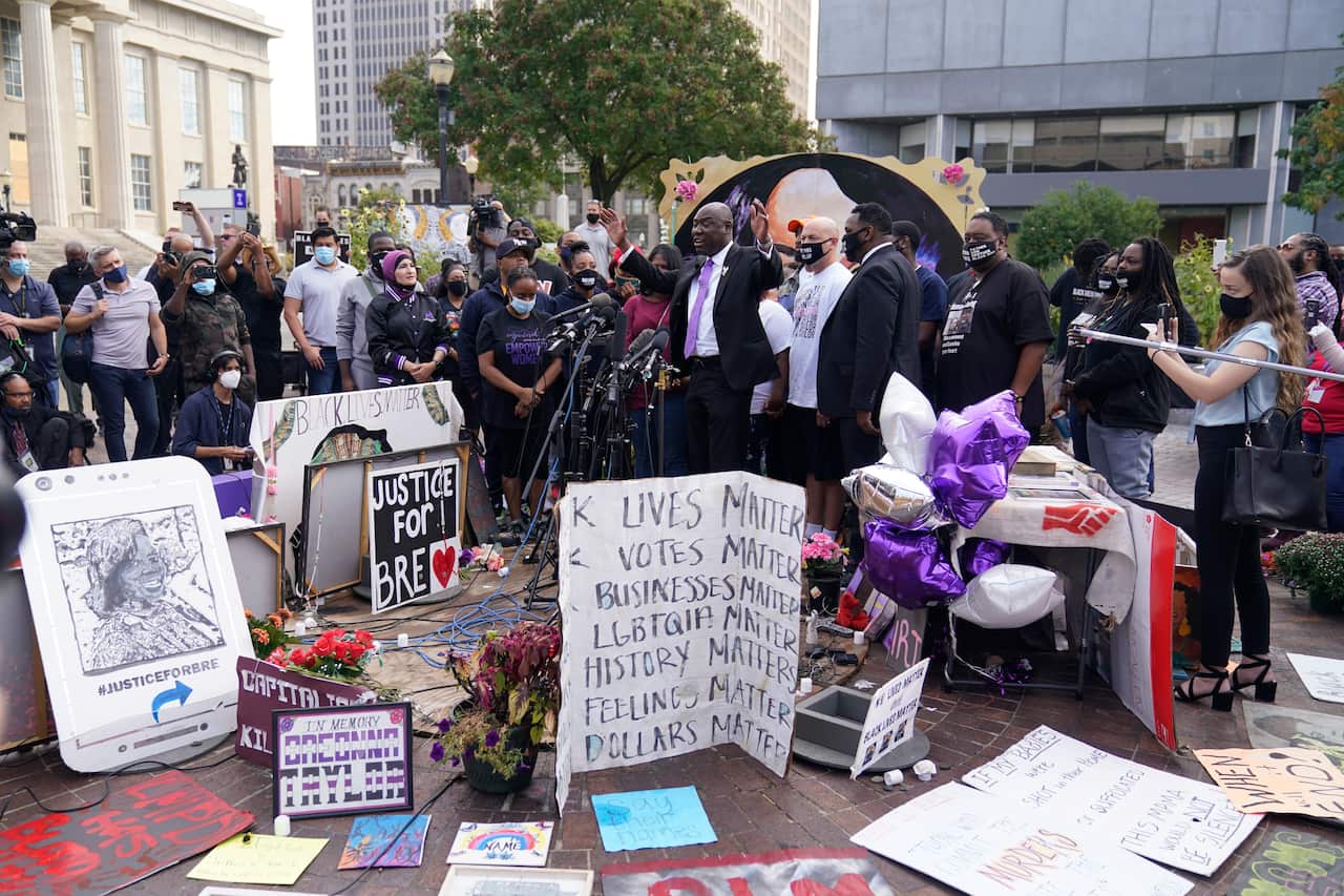 Breonna Taylor family attorney Ben Crump, center, speaks during a news conference in Louisville on 25 September.