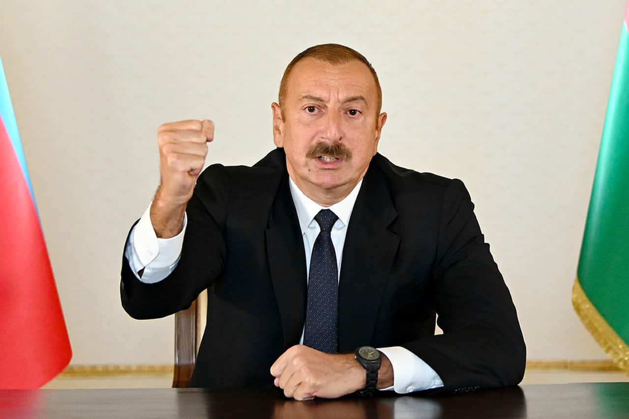 Azerbaijani President Ilham Aliyev gestures as he addresses the nation in Baku, Azerbaijan.