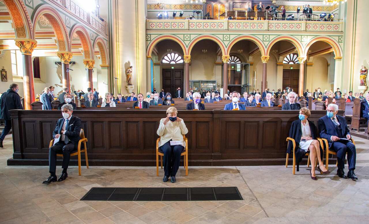 Stephan Harbarth, President of Federal Constitutional Court, German Chancellor Angela Merkel, German President Frank-Walter Steinmeier with his wife Elke Buendenbender arrive for an ecumenical church service at Saint Peter and Paul church in Potsdam