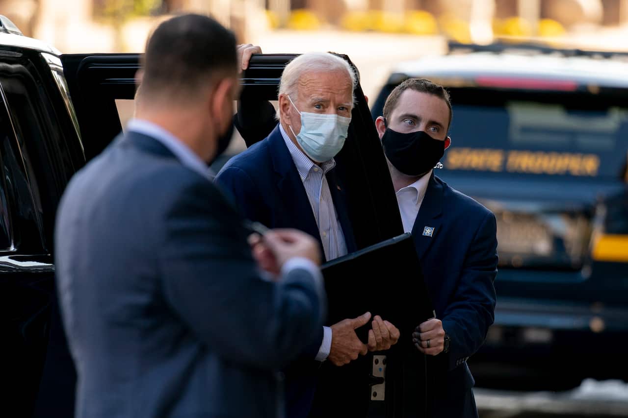Democratic presidential candidate former Joe Biden arrives at the Queen Theater for virtual town hall.
