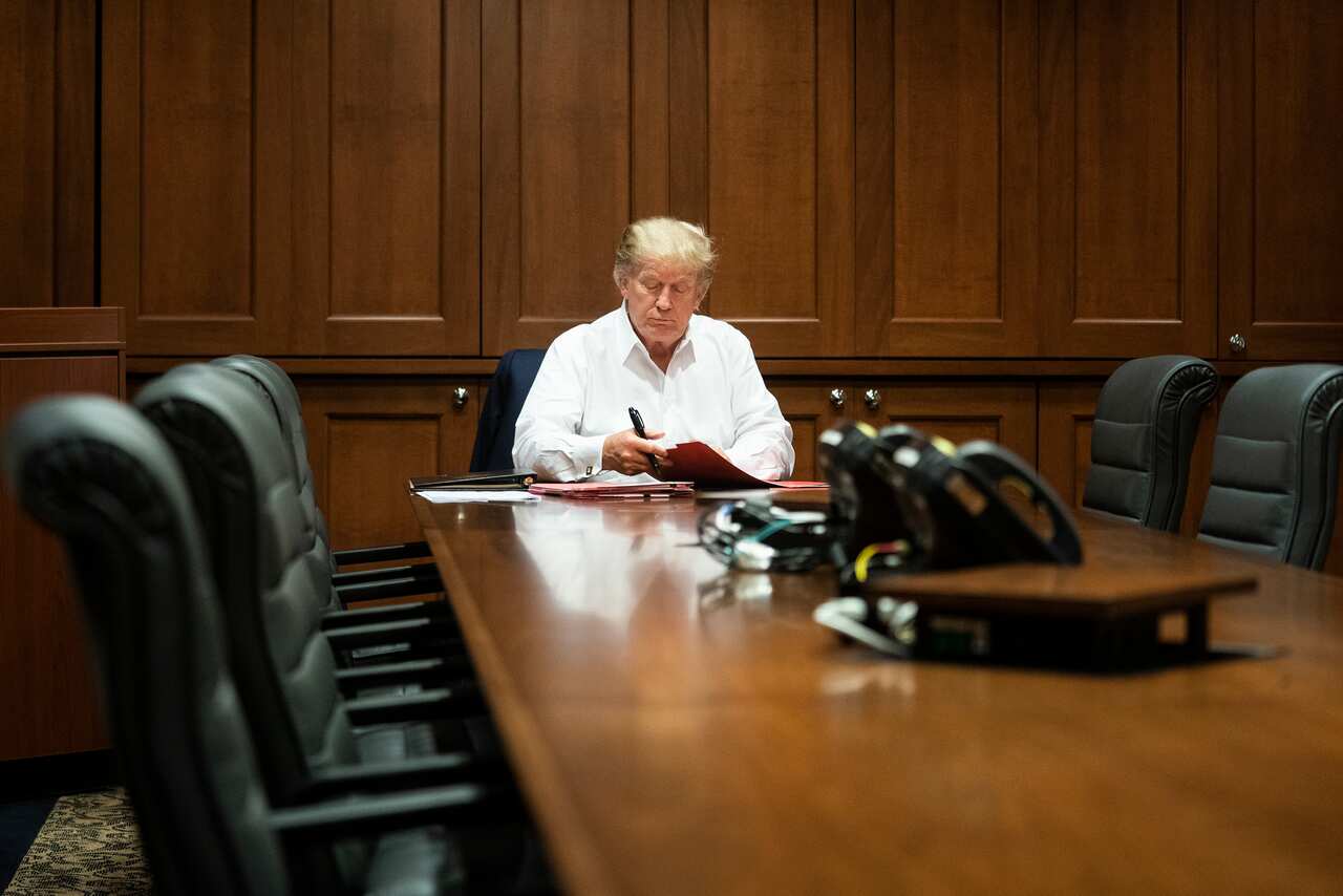 US President Donald Trump works in his conference room at Walter Reed National Military Medical Centre.