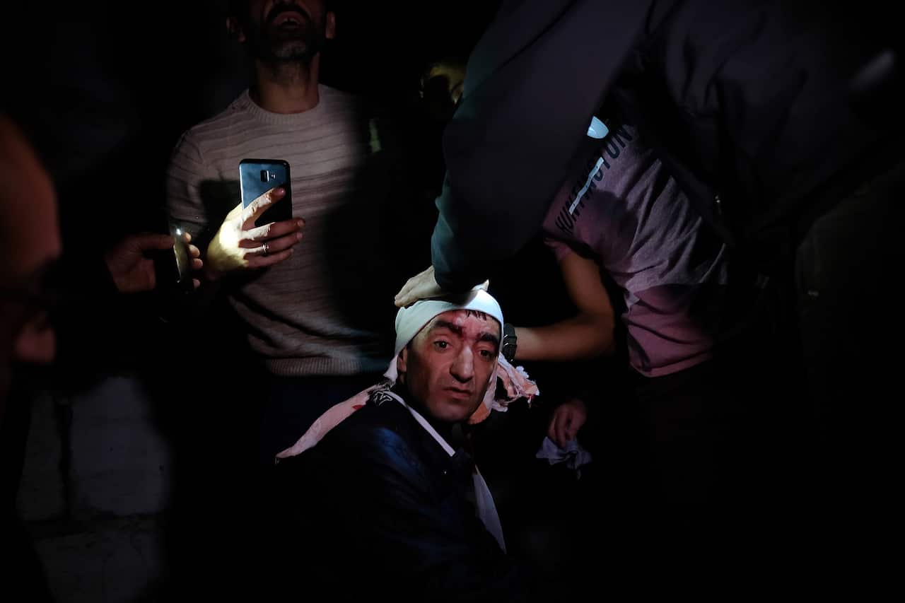An injured man receives a medical treatment after shelling by Azerbaijani artillery, Stepanakert, Nagorno-Karabakh.
