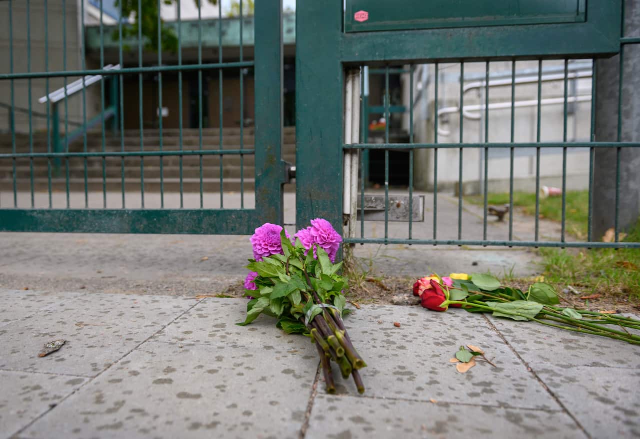 Flowers lays in front of a synagogue, near where a 29-year-old man struck a 26-year-old Jewish student with a blunt object. 