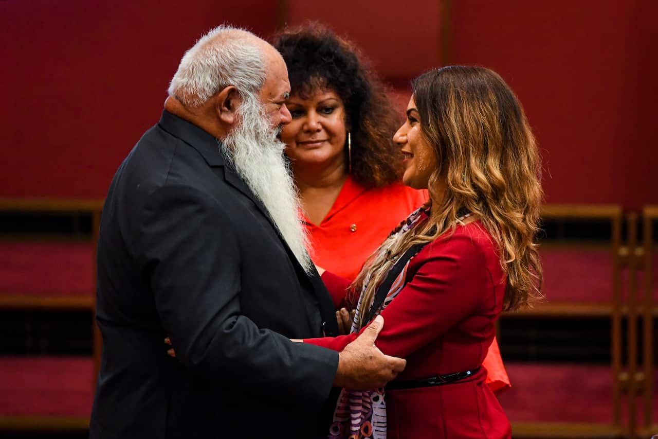 Greens Senator Senator Lidia Thorpe (centre) is congratulated by Labor Senators Pat Dodson.
