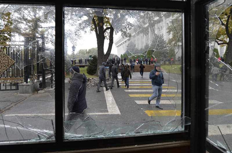 Protesters gather in front of the government headquarters on the central square in Bishkek, Kyrgyzstan, Tuesday, Oct. 6, 2020