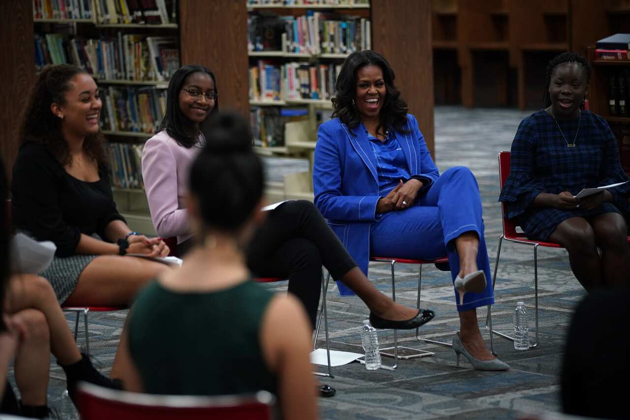 Former first lady Michelle Obama visits young women at Whitney M. Young Magnet High School in Chicago.
