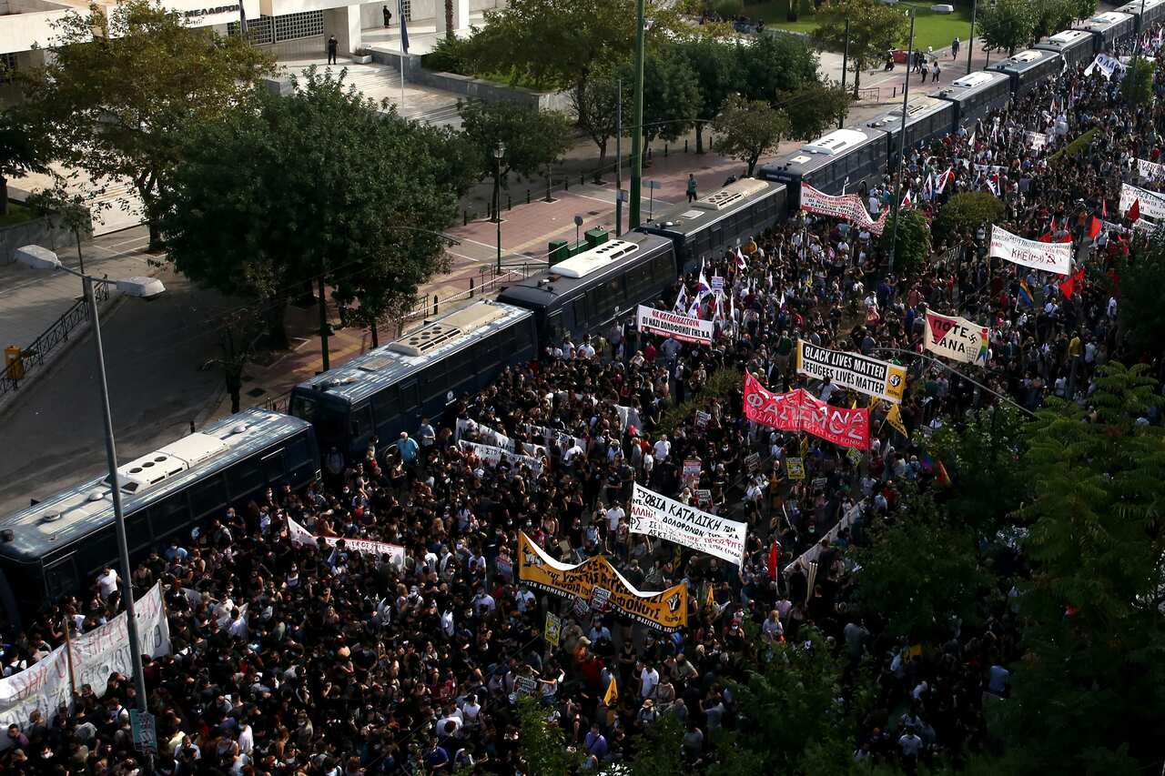 People gathered outside Athens' courthouse as they waited for the verdict.