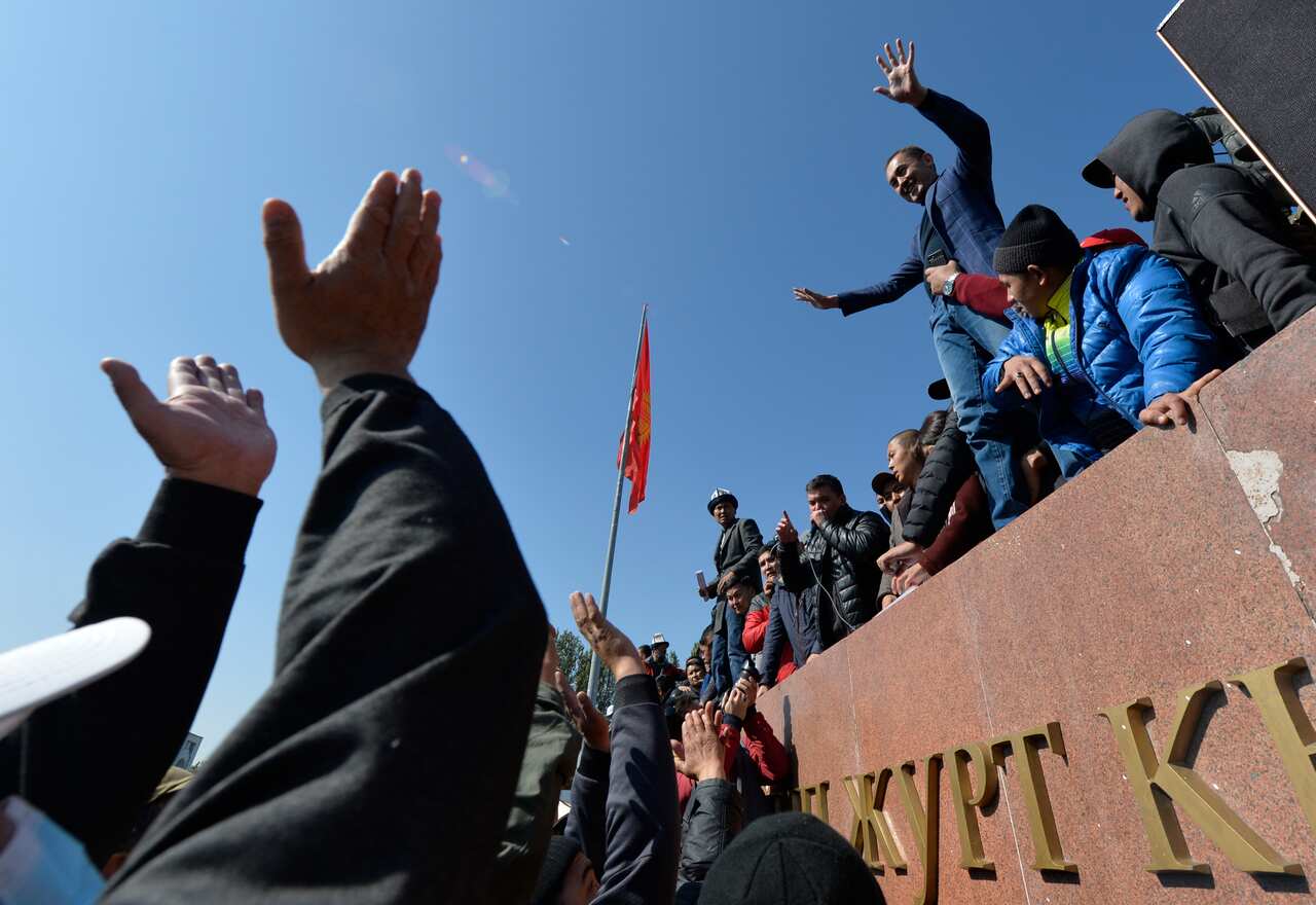 People protest during a rally on the central square in Bishkek, Kyrgyzstan on 7 October. 