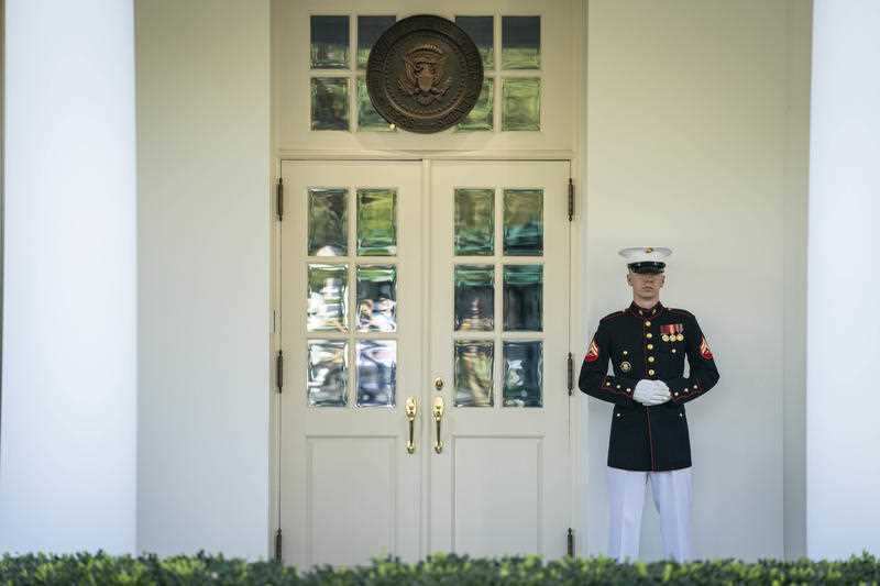 A Marine is seen on duty outside of the West Wing 