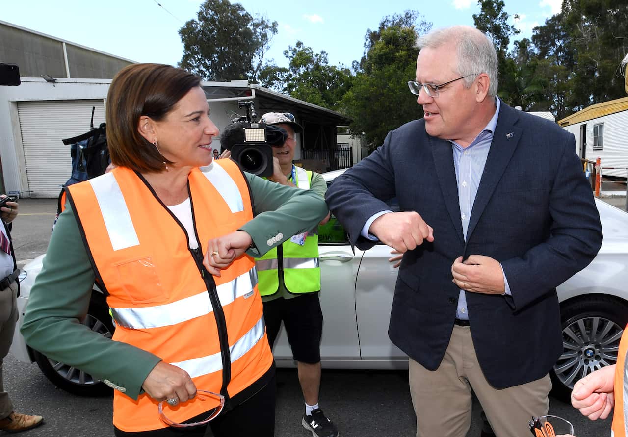 Queensland LNP leader Deb Frecklington greets Prime Minister Scott Morrison on arrival for a tour of Neumann Steel Fabrication on the Gold Coast on 10 October.