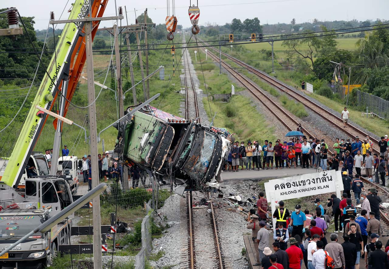 At least 18 people were killed after a bus heading to a Buddhist temple has collided with a train in central Thailand.