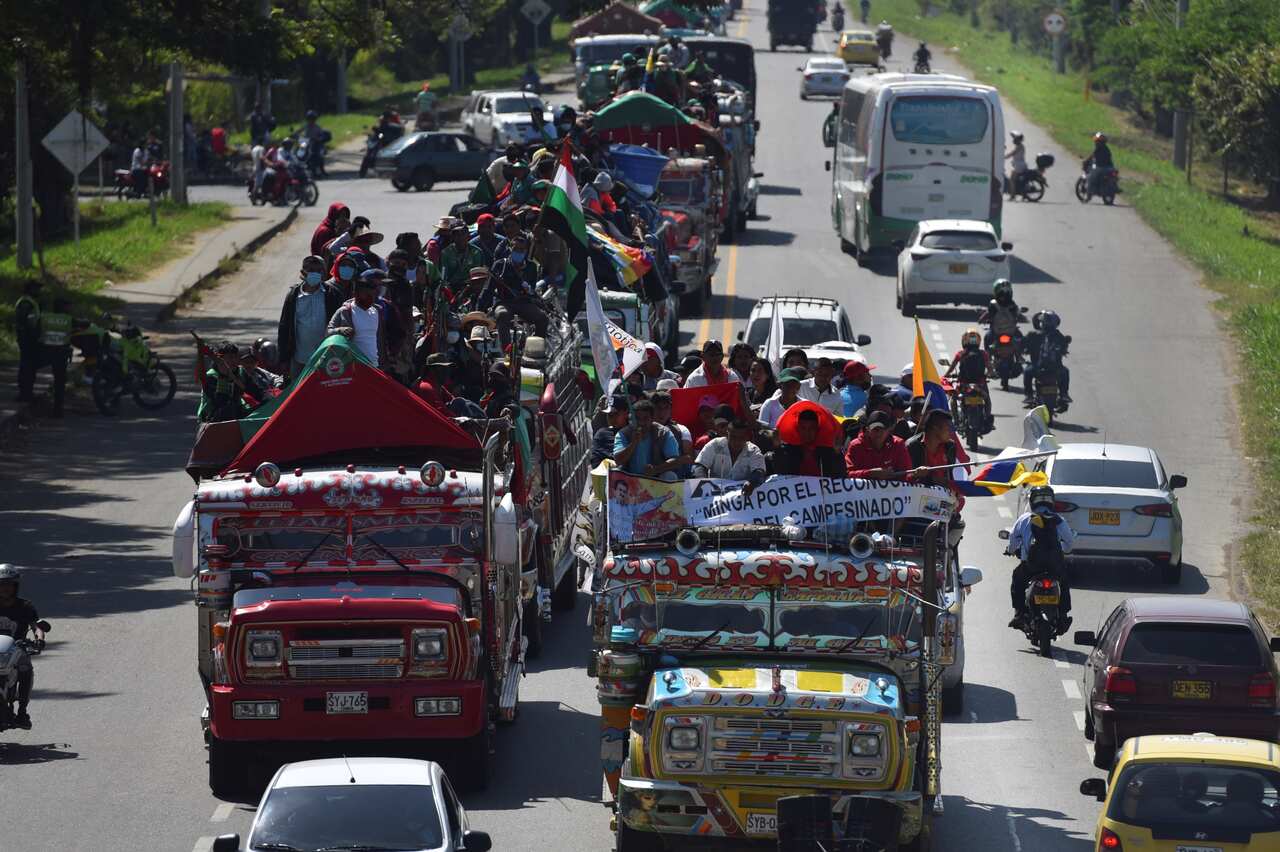 A caravan of indigenous people arrives in the city of Jamundi, from where they will leave on a march to Cali, southwestern Colombia, 12 October 2020. 