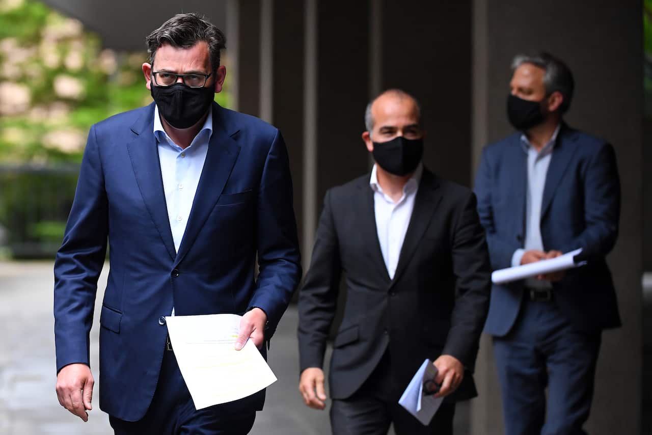 Victorian Premier Daniel Andrews (left) arrives at a press conference in Melbourne, on Tuesday 13 October.