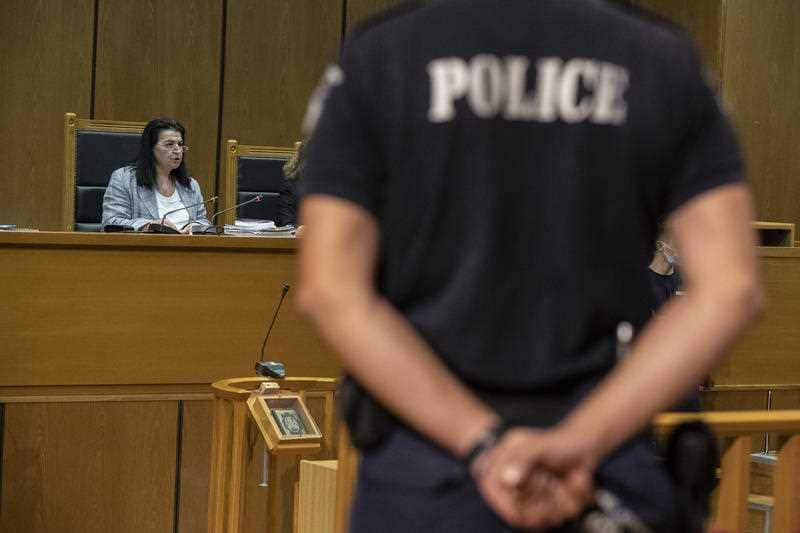 Presiding judge Maria Lepenioti reads the sentences during the Golden Dawn trial, in Athens, Wednesday, Oct. 14, 2020