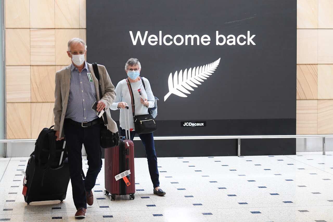 Passengers from New Zealand arrive at Sydney International Airport on Friday.