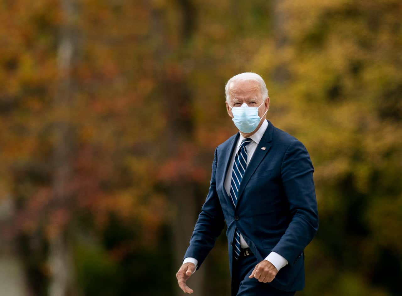 Democratic presidential candidate former Vice President Joe Biden looks to supporters and members of the press while arriving to a campaign event Friday, Oct. 16. 2020 in Southfield, Mich. (Nicole Hester/Ann Arbor News via AP)